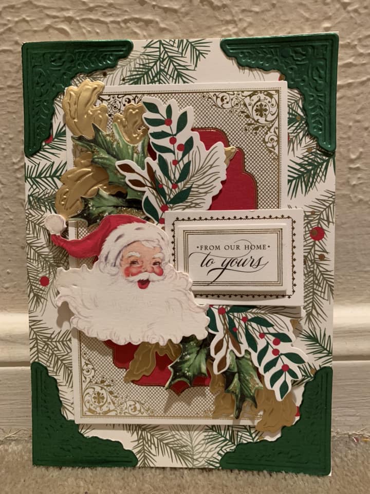 A christmas card with a santa clause on it.
