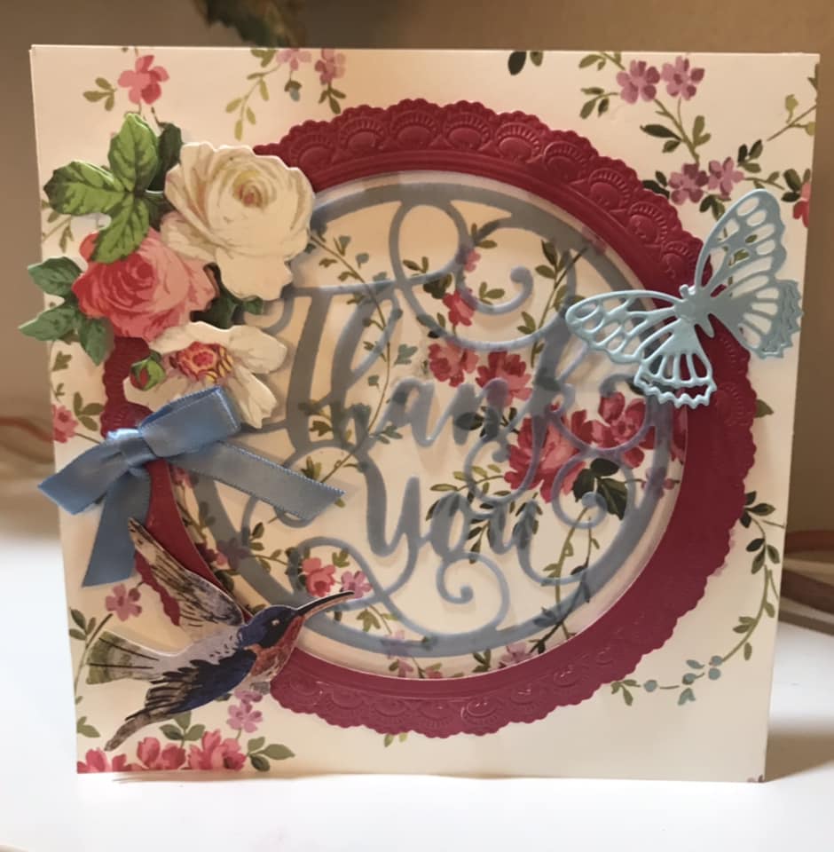 A thank you card with flowers and butterflies.