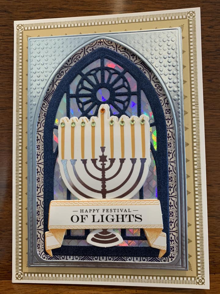 A hanukkah card with a menorah on it.